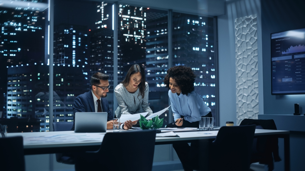 People looking at a paper in an office